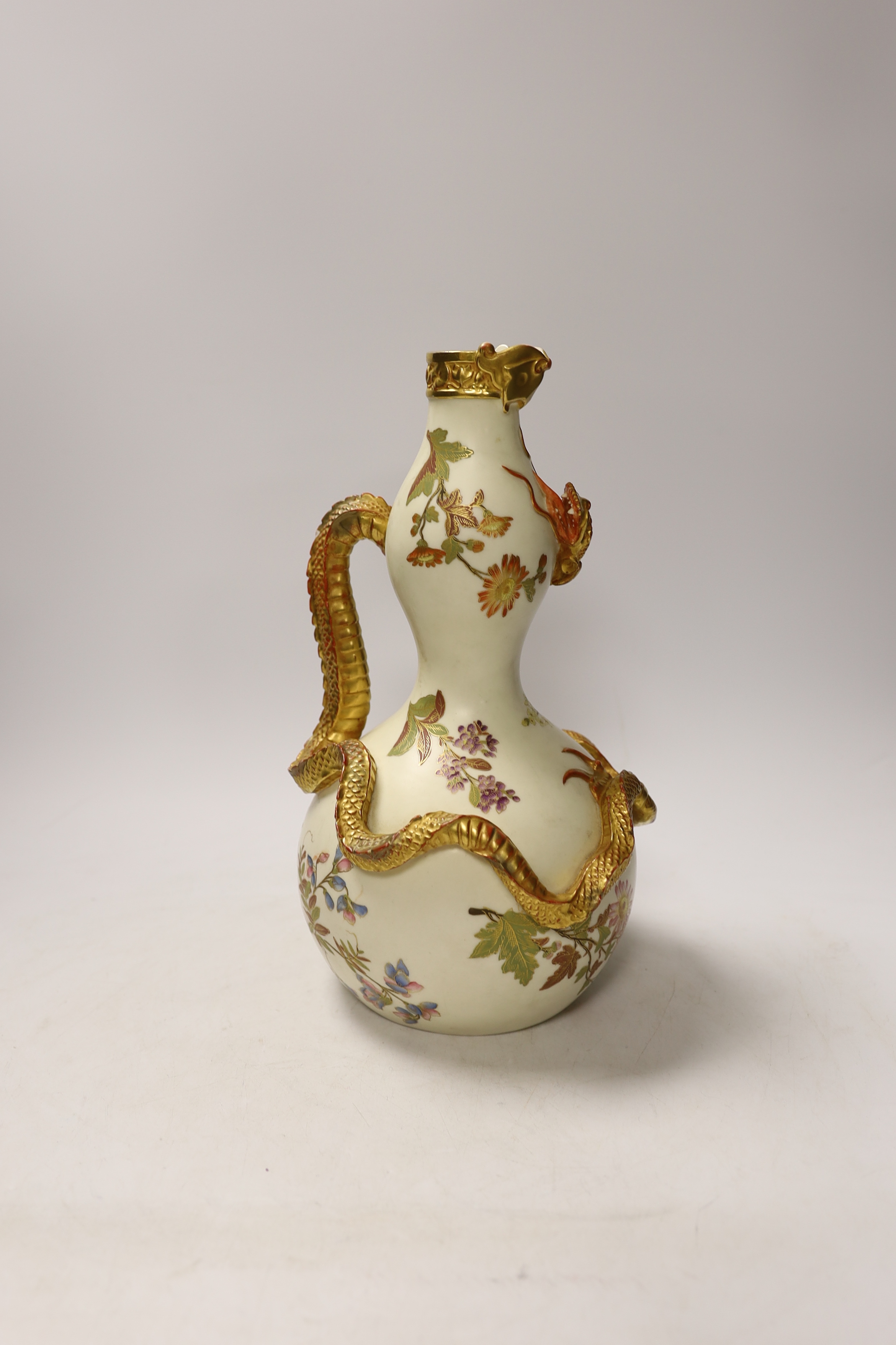 A Royal Worcester ewer with dragon handle, numbered 1035, 29cm high